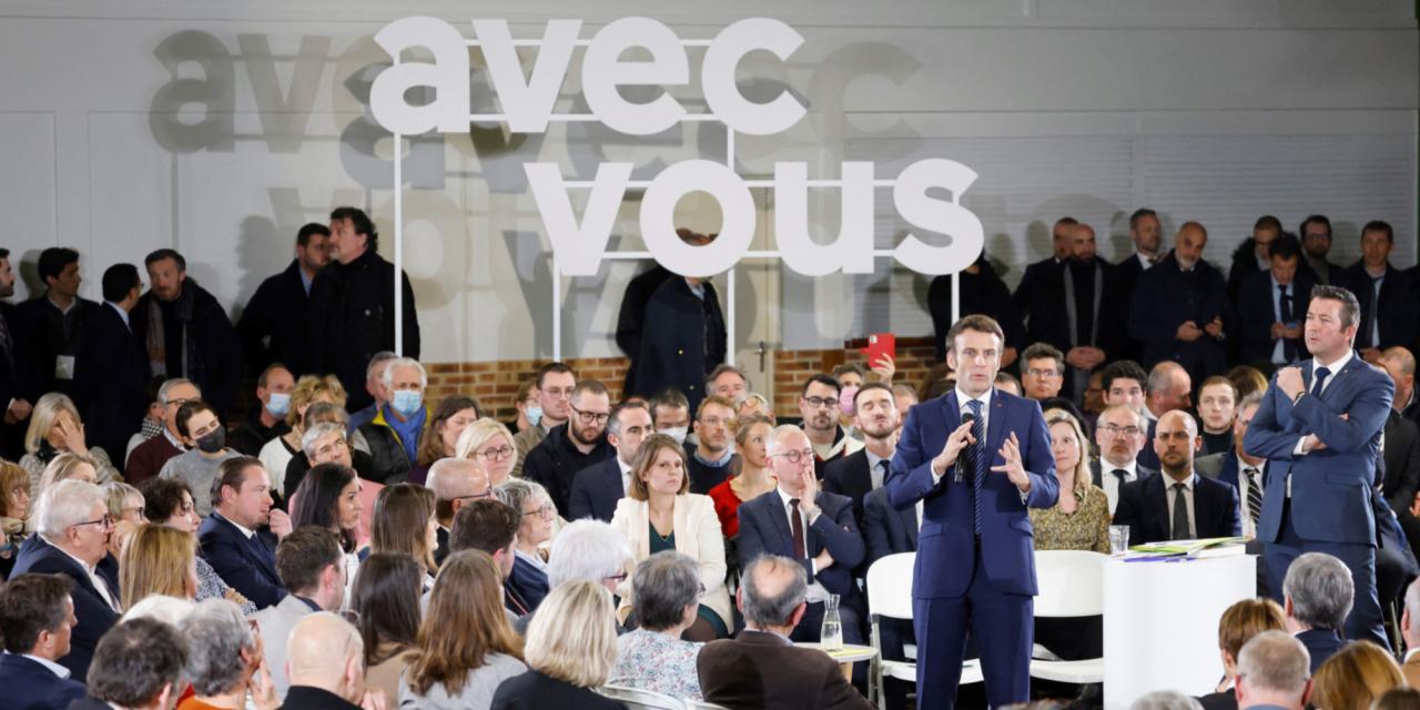 Macron emmanuel political campaign meeting positions heavy facts fast nantes applauds getty during april