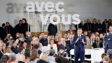 Macron emmanuel political campaign meeting positions heavy facts fast nantes applauds getty during april