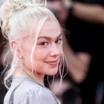 Phoebe Bridgers Challenges Hollywood Beauty Standards with Unshaved Legs and Sweat on the Venice Film Festival Red Carpet